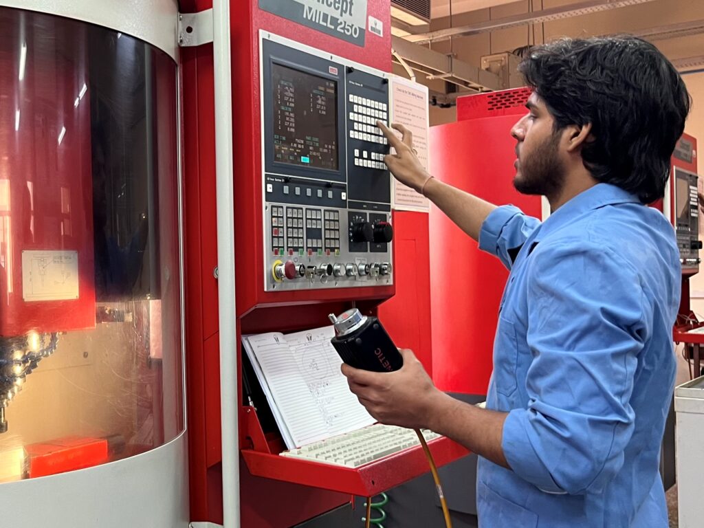 Student at BSDU working on a CNC machine, demonstrating industry-integrated skill development and measurable competency progression.