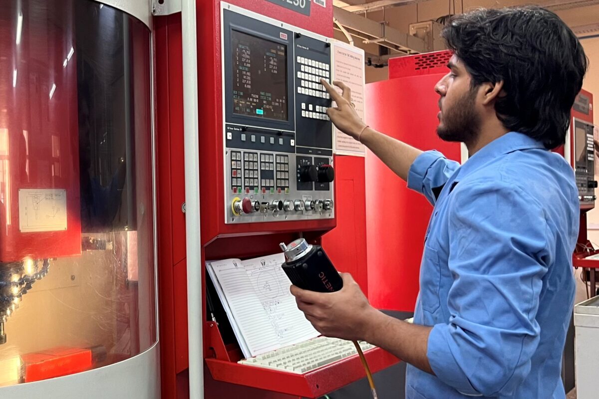 Student at BSDU working on a CNC machine, demonstrating industry-integrated skill development and measurable competency progression.